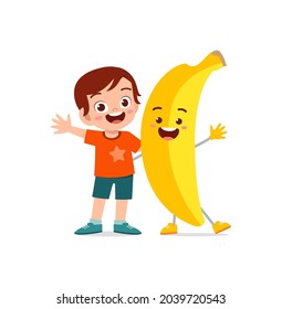 cute little boy stands with banana character