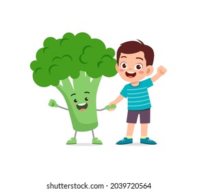 cute little boy stands with broccoli character