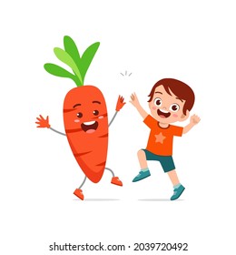 cute little boy stands with carrot character