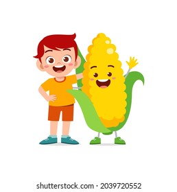 cute little boy stands with corn character