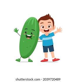 cute little boy stands with cucumber character