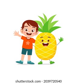 cute little boy stands with pineapple character
