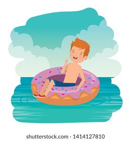 cute little boy with swimsuit and donut float on the sea