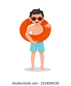 cute little boy with swimsuit and sun glasses holding inflatable rubber ring circle around having fun on summer time