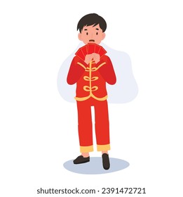 Cute Little Boy in Traditional Chinese Attire Holding Red Envelope. Happy Chinese new year.