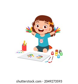 cute little boy using paint to hand for art