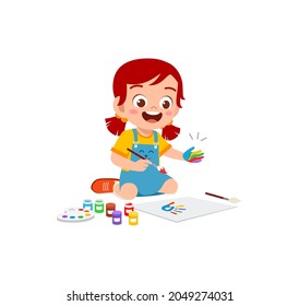 cute little boy using paint to hand for art