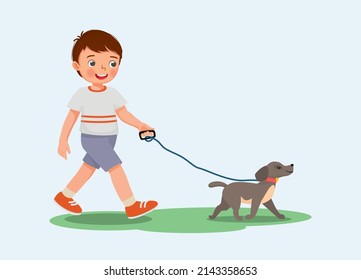 Cute little boy walking the dog in the park 