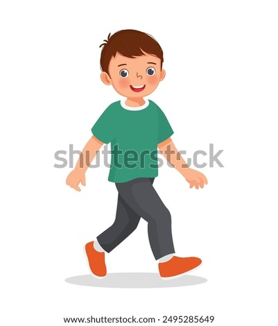 cute little boy walking on the street