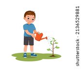 cute little boy watering plants flowers in the pot with watering can in the garden