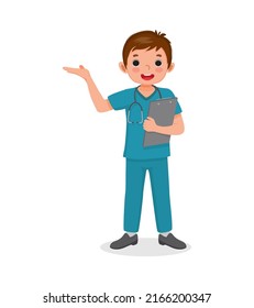 cute little boy wear nurse uniform holding clipboard with hand showing. Job and occupation concept for educational purpose