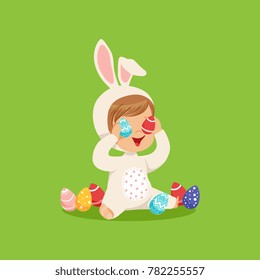 Cute little boy in a white bunny costume sitting and playing with eggs, kid having fun on Easter egg hunt vector Illustration