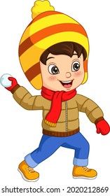 Cute little boy in winter clothes throwing snowball