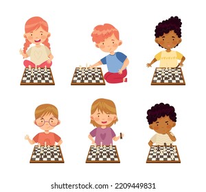 Cute little boys and girls playing strategy chess game set cartoon vector illustration