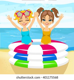cute little brother and sister with raised arms swimming in inflatable pool at the beach