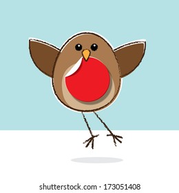 Cute little brown Robin Red Breast flying and holding a paper disk in beak