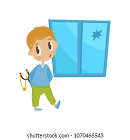 Cute little bully boy with a slingshot in front of crashed window, hoodlum cheerful kid, bad child behavior vector Illustration on a white background