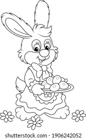 Cute little bunny in a beautiful holiday dress holding a dish with chocolate Easter eggs, black and white outline vector cartoon illustration for a coloring book page