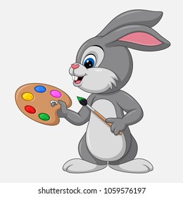 Cute little bunny with brush watercolor paints and palette isolated on white background