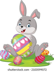 Cute little bunny with Easter egg in the grass