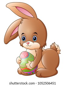 Cute little bunny holding decorated easter egg