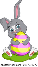 Cute little bunny holding easter egg
