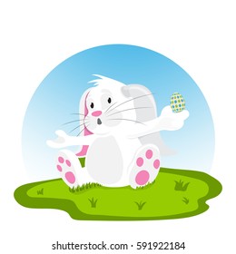 Cute little bunny holding an easter egg.