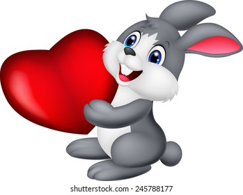 Cute little bunny holds red hart