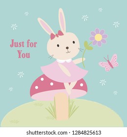 A cute little bunny sitting on a toadstool, holing a flower, just for you!