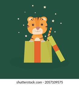 Cute little cartoon tiger in a Christmas gift box. Happy Chinese New Year 2022 festive design Flat vector illustration on a green background