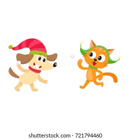 Cute little cat and dog characters playing snowballs, having fun, winter activity, cartoon vector illustration isolated on white background. Little baby cat and dog animal characters playing snowballs