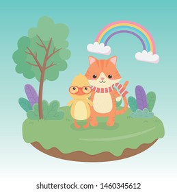 cute and little cat and duck in the field