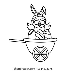 cute little chick with eggs painted in wheelbarrow