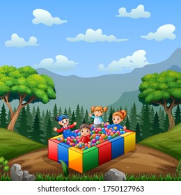 Cute little children playing on balls pool having fun together