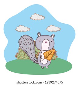 cute little chipmunk with leaf in the field