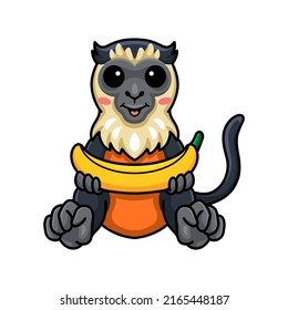 Cute little diana monkey cartoon holding banana