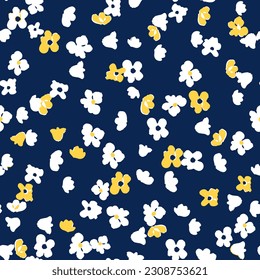 Cute little ditsy daisy seamless repeat pattern. Random placed, vector floral botany all over surface print on dark blue background.
