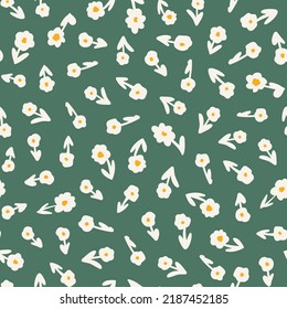 Cute little flowers with leaves seamless repeat pattern. Random placed, vector botany all over surface print on green background.