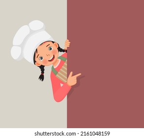 cute little girl in chef hat and apron peeking from board pointing finger to empty banner for copy space