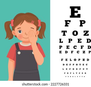 Cute little girl cover her eye having vision test reading block letters at ophthalmologist office