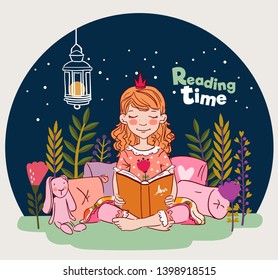 Cute little girl with crown reading a book in the garden