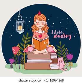 Cute little girl with crown reading a book in the garden