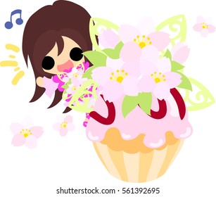 A cute little girl and a cupcake of cherry blossom