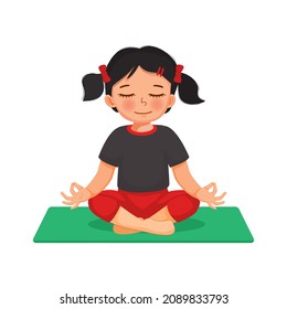 Cute little girl doing gymnastic fitness exercises practicing yoga meditation sitting in lotus pose on a mat indoor