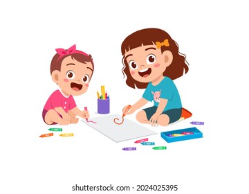 cute little girl drawing together with baby sibling