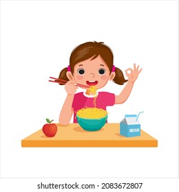 Cute little girl eating delicious noodles with chopsticks and showing okay sign hand gesture

