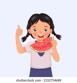 Cute little girl eating watermelon showing thumb up on sunny day in summertime