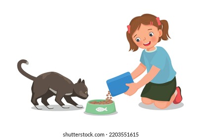 Cute little girl feeding her pet cat with animal food at home