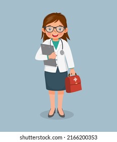 cute little girl with glasses wear doctor uniform holding clipboard and medical bag. Job and occupation concept for educational purpose