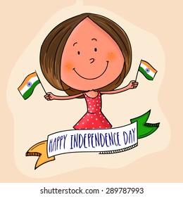 Cute little girl holding flag in both hands with national tricolor ribbon for Indian Independence Day celebration.